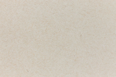 Light brown paper with swirling fibers. 