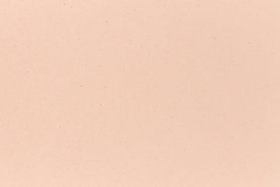 Bright orange cover-weight cardstock viewed close up. 